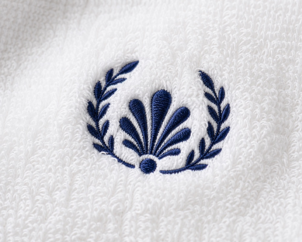 Hotel logo embroidered on a white towel